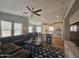 Spacious living room with sectional sofa and large TV at 650 N Hawes Rd # 4409, Mesa, AZ 85207