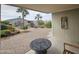 Relaxing patio with table and chairs, overlooking a garden at 650 N Hawes Rd # 4409, Mesa, AZ 85207