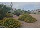 Landscaped community with mature plants and desert landscaping at 650 N Hawes Rd # 4409, Mesa, AZ 85207