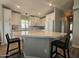Modern kitchen with large island and white cabinetry at 650 N Hawes Rd # 4409, Mesa, AZ 85207