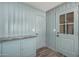 Light-filled hallway with built-in storage and wood flooring at 3156 E Carmel Cir, Mesa, AZ 85204