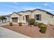 Single-story home with a two-car garage and landscaping at 269 S 190Th Dr, Buckeye, AZ 85326