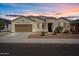 Single-story home with a two-car garage and landscaped front yard at 269 S 190Th Dr, Buckeye, AZ 85326