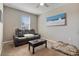 Relaxing living room featuring a sectional sofa and coffee table at 269 S 190Th Dr, Buckeye, AZ 85326