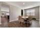 Bright dining area with a table, chairs, and view of the living room at 269 S 190Th Dr, Buckeye, AZ 85326