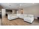 Relaxing living room featuring a large sectional sofa and ceiling fan at 269 S 190Th Dr, Buckeye, AZ 85326