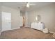 Spacious bedroom with a white dresser and ceiling fan at 269 S 190Th Dr, Buckeye, AZ 85326