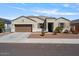 Single-story home with a two-car garage and landscaping at 269 S 190Th Dr, Buckeye, AZ 85326