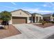 Inviting exterior with two-car garage and landscaped yard at 269 S 190Th Dr, Buckeye, AZ 85326