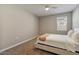 Bright bedroom with a queen bed and neutral decor at 269 S 190Th Dr, Buckeye, AZ 85326