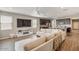 Open concept living room with sectional sofa and views to kitchen at 269 S 190Th Dr, Buckeye, AZ 85326