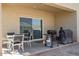 Covered patio with seating area and built-in grill at 269 S 190Th Dr, Buckeye, AZ 85326