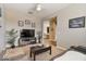 Comfortable living room with a TV, fireplace, and seating area at 269 S 190Th Dr, Buckeye, AZ 85326