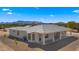 Rear view of house showcasing covered patio, neutral color scheme, and mountain backdrop at 29811 N 154Th St, Scottsdale, AZ 85262