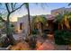 Charming courtyard patio with seating area and landscaping at 19032 E Alondra Way, Rio Verde, AZ 85263