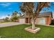 House exterior with a well-maintained lawn and driveway at 2300 E Wildhorse Pl, Chandler, AZ 85286