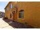 Exterior view of a tan townhome with stone accents at 1350 S Greenfield S Rd # 1081, Mesa, AZ 85206