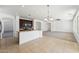 Kitchen with island, dark wood cabinets and tile floors at 5213 W Pedro Ln, Laveen, AZ 85339