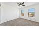 Bright bedroom with ceiling fan and carpet at 5213 W Pedro Ln, Laveen, AZ 85339