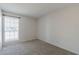 Well-lit bedroom featuring neutral walls and carpet at 16410 S 46Th Pl, Phoenix, AZ 85048