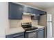 Modern kitchen with stainless steel appliances and white quartz countertops at 16410 S 46Th Pl, Phoenix, AZ 85048
