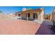 Backyard view showcasing covered patio and brick pavers at 16410 S 46Th Pl, Phoenix, AZ 85048