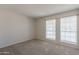 Bright bedroom with neutral walls, carpet, and two large windows at 16410 S 46Th Pl, Phoenix, AZ 85048