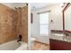 Updated bathroom with granite vanity, tile flooring and shower/tub combo at 16410 S 46Th Pl, Phoenix, AZ 85048
