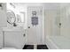 Clean bathroom with white vanity, bathtub, and glass shower at 2233 E Behrend Dr # 210, Phoenix, AZ 85024