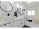 Modern bathroom with double vanity and large mirrors at 2233 E Behrend Dr # 210, Phoenix, AZ 85024