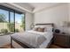Bedroom with a queen-size bed and backyard view at 7300 E Earll Dr # 1012, Scottsdale, AZ 85251
