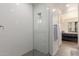 Modern shower with glass enclosure and white tile at 7300 E Earll Dr # 1012, Scottsdale, AZ 85251