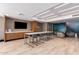 Community room featuring a large TV, tables, and comfortable seating at 7300 E Earll Dr # 1012, Scottsdale, AZ 85251