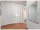 Entryway with hardwood floors and a half-bathroom at 7300 E Earll Dr # 1012, Scottsdale, AZ 85251