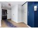 Apartment hallway with blue walls and carpet at 7300 E Earll Dr # 1012, Scottsdale, AZ 85251