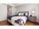 Bright bedroom with king-size bed and hardwood floors at 7300 E Earll Dr # 1012, Scottsdale, AZ 85251