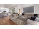 Open living area with modern sofa and hardwood floors at 7300 E Earll Dr # 1012, Scottsdale, AZ 85251