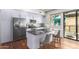 Modern kitchen with L-shaped island and stainless steel appliances at 7300 E Earll Dr # 1012, Scottsdale, AZ 85251