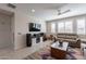 Living room featuring comfortable seating and entertainment center at 21207 E Domingo Rd, Queen Creek, AZ 85142