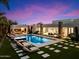 Large rectangular pool with a fire pit and plenty of lounge space at 24351 N 97Th Dr, Peoria, AZ 85383