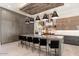 Modern kitchen with a large island, custom cabinetry, and high-end appliances at 24351 N 97Th Dr, Peoria, AZ 85383