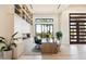 Modern home office with built-in shelves and large windows at 24351 N 97Th Dr, Peoria, AZ 85383