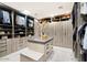 Large walk-in closet with ample shelving and drawers at 24351 N 97Th Dr, Peoria, AZ 85383