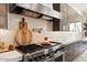 Luxury kitchen with stainless steel appliances and herringbone backsplash at 24351 N 97Th Dr, Peoria, AZ 85383