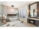Elegant bathroom with a freestanding tub, fireplace, and large shower at 24351 N 97Th Dr, Peoria, AZ 85383