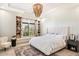 Spacious bedroom with large window and built-in shelves at 24351 N 97Th Dr, Peoria, AZ 85383