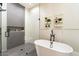 Bathroom with walk-in shower and freestanding tub at 24351 N 97Th Dr, Peoria, AZ 85383