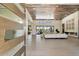 Open living room with high ceilings, modern furniture and a large chandelier at 24351 N 97Th Dr, Peoria, AZ 85383
