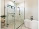 Spa-like bathroom with walk-in shower and soaking tub at 24351 N 97Th Dr, Peoria, AZ 85383
