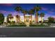 Modern house exterior with palm trees and an elegant entryway at 24351 N 97Th Dr, Peoria, AZ 85383